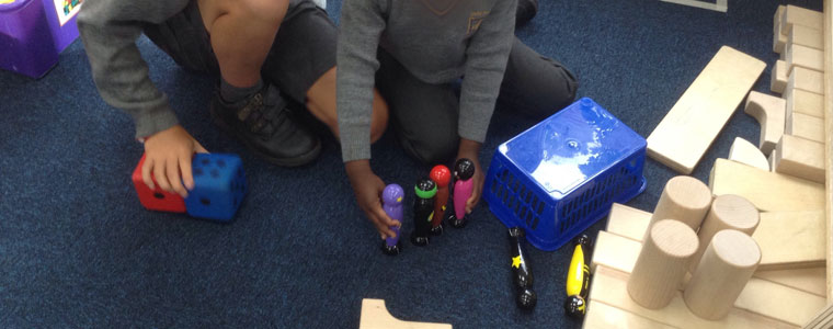 children playing with superpower superhero toy set