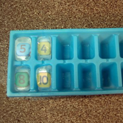 freezing wooden number in ice cubes