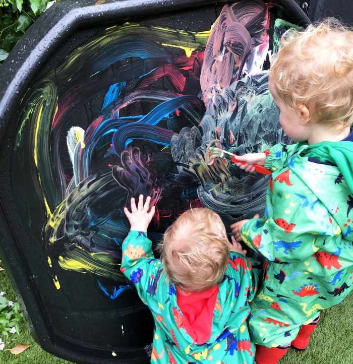 children painting on jumbo tuff tray