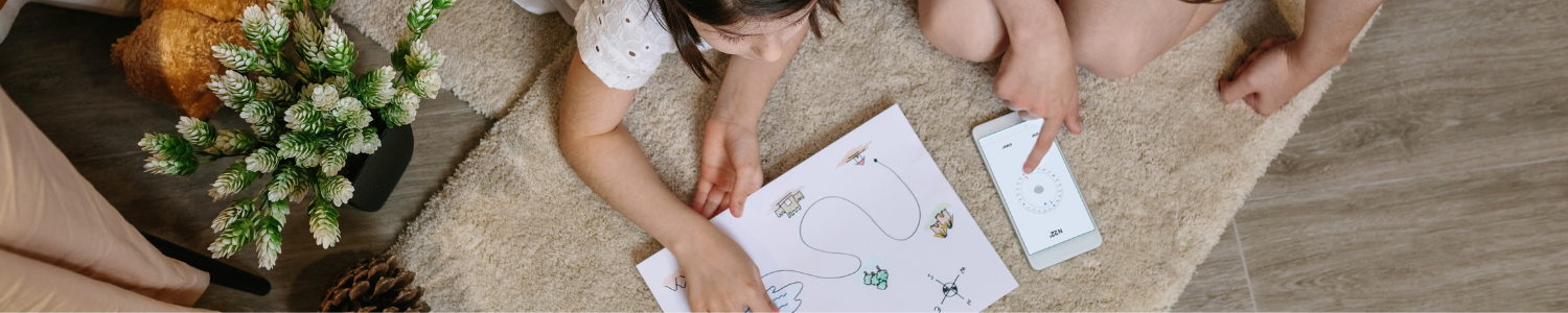 children tracing activity on white paper