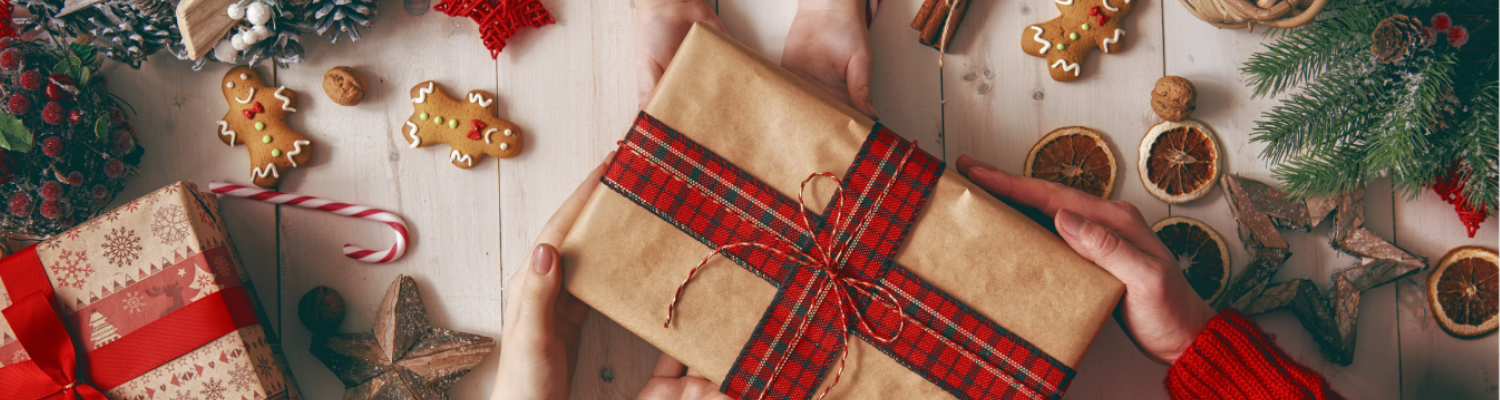 Hands holding Christmas presents 