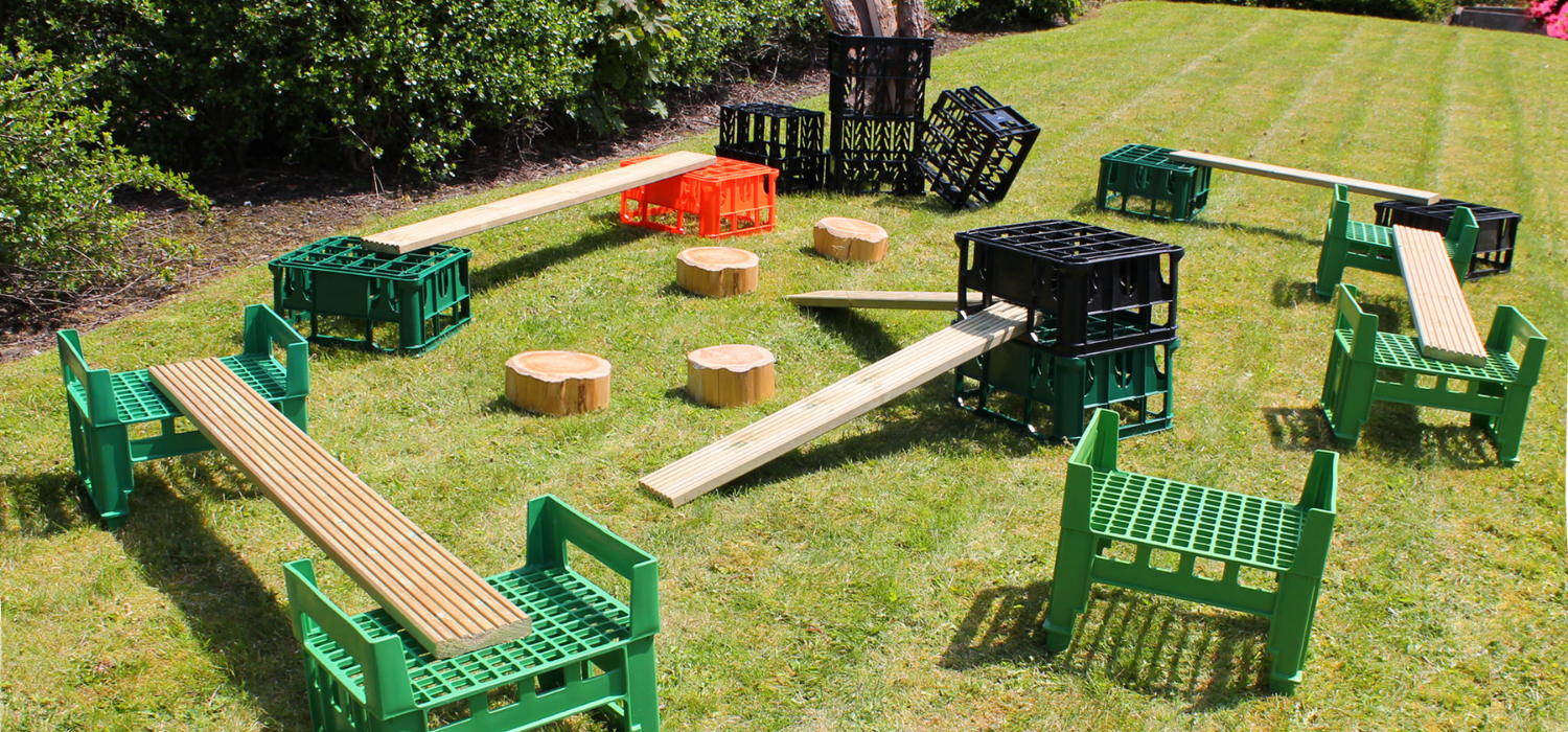 Obstacle course made from crates, planks and logs 