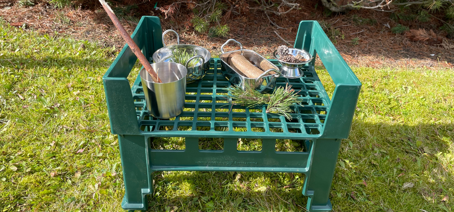 mud kitchen area made using crate