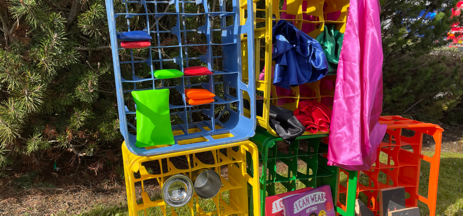 crates used to store bean bags, fabrics, books and mud kitchen equipment