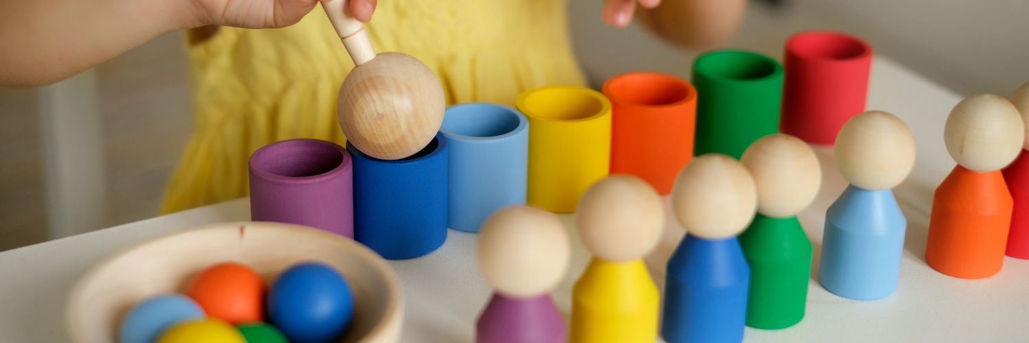 child playing with heuristic instrument