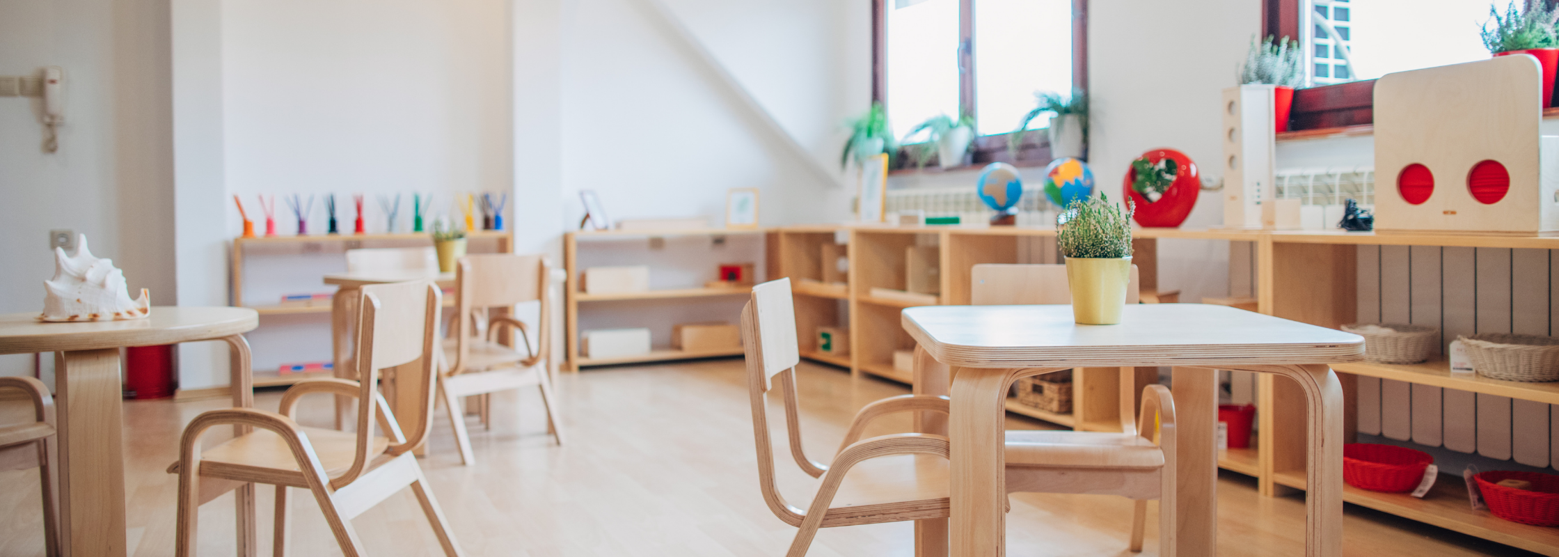 nursery classroom with wooden furniture 