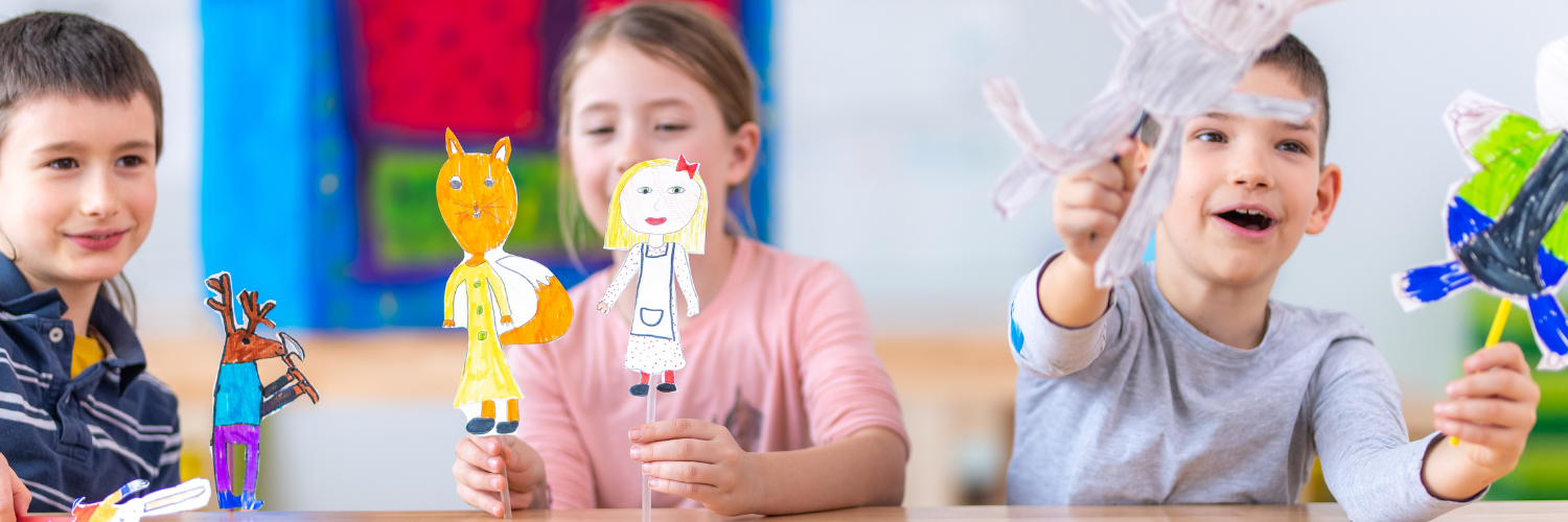 children playing with paper cut out characters