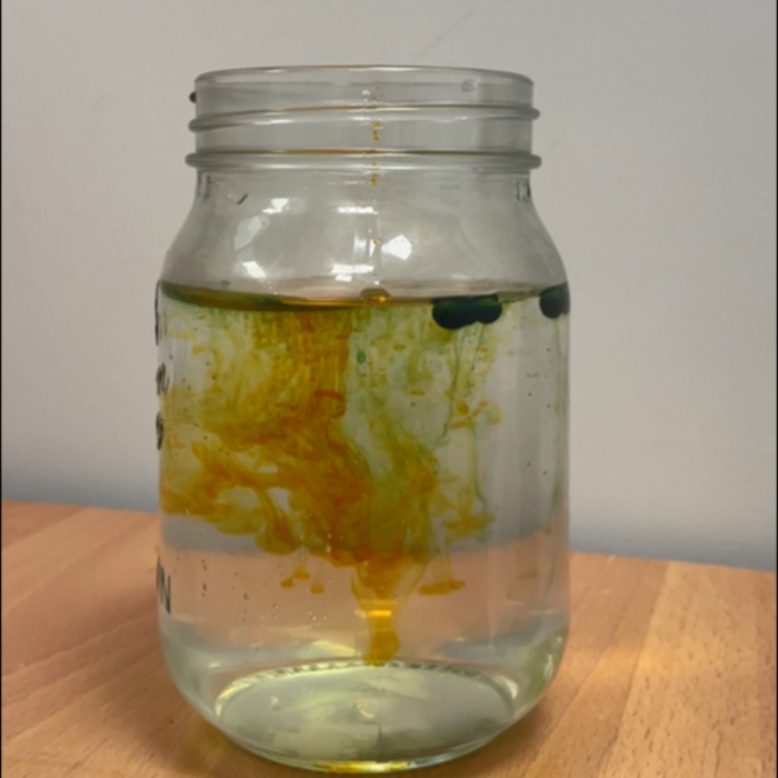 yellow and green water firework jar