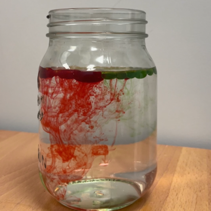 red and green water firework jar