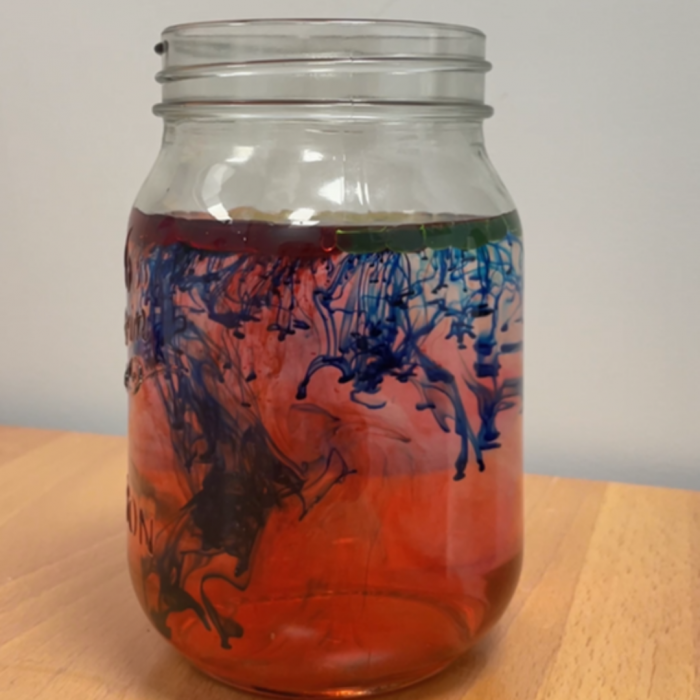 blue, green and red water firework jar