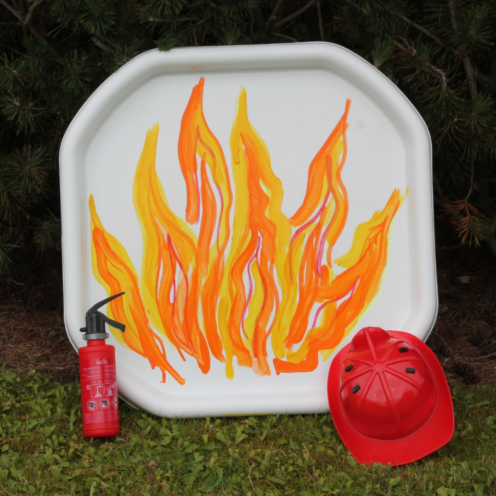 white tuff tray with a fire painted on