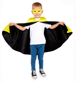 child wearing a superhero cape and mask