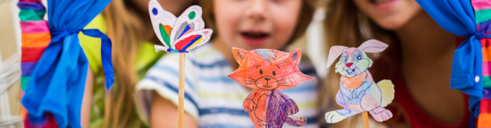 children using makeshift puppets