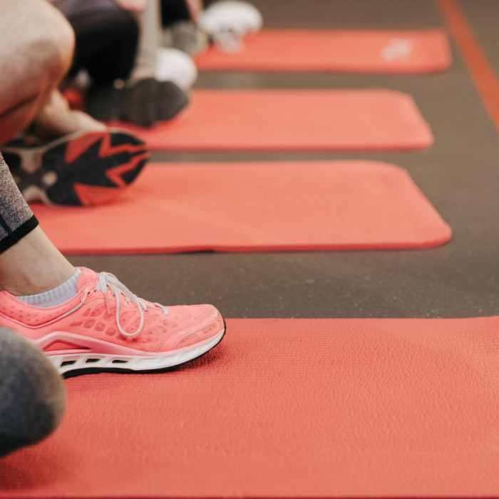 exercising on red yoga mat