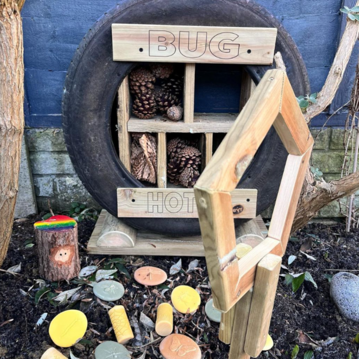 bug hotel made from tyres and dry wood