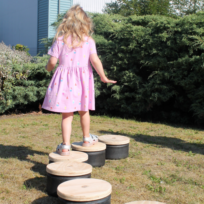 Little girl doing an obstacle course