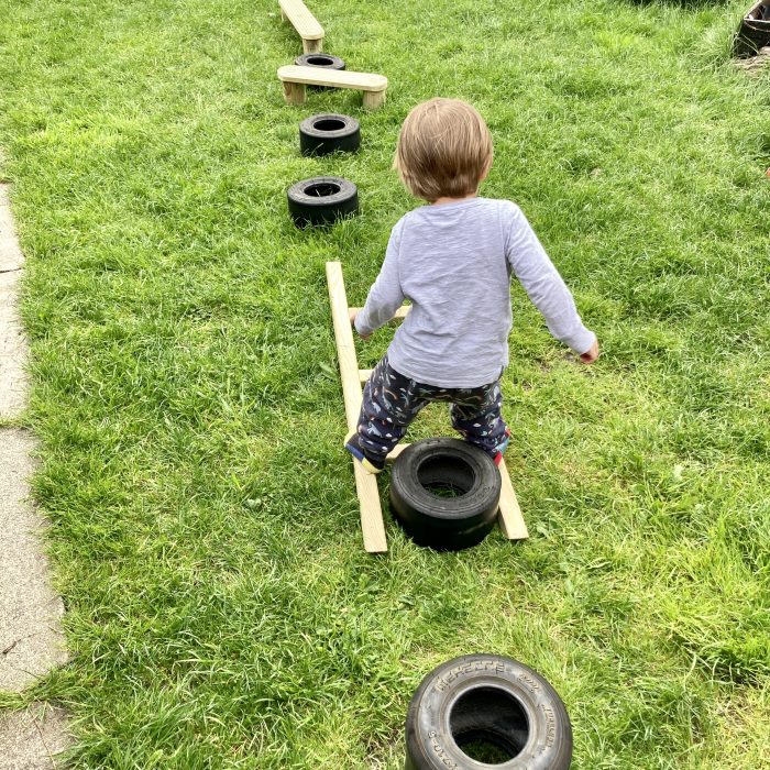 child doing an obstacle course