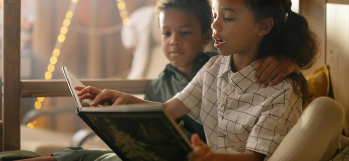 Brother and sister reading together