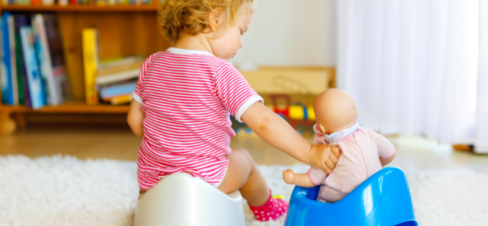 Child engaging in role play with a doll